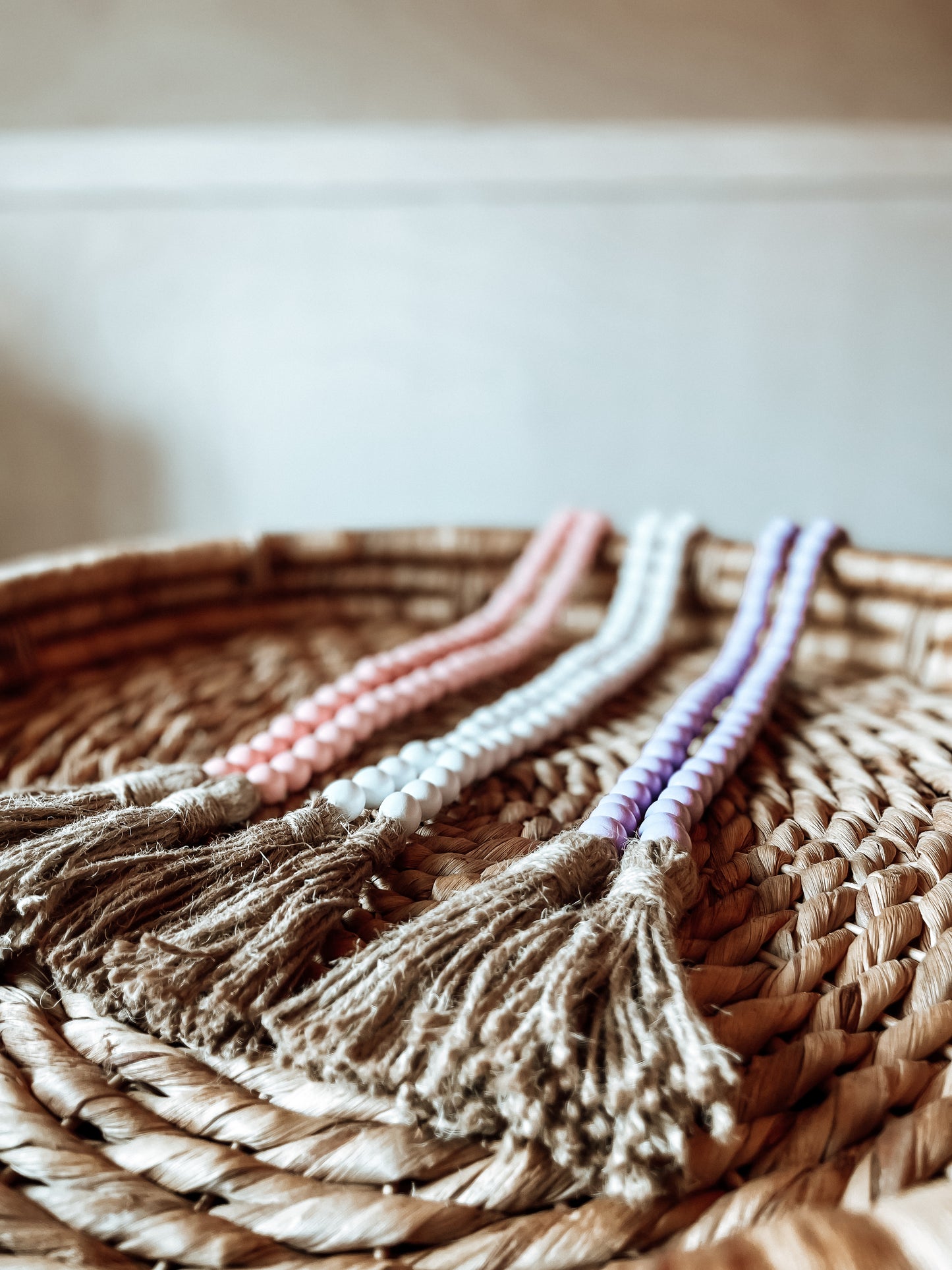 Pastel wooden beaded garlands with jute tassels